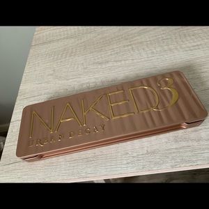 Urban decay Naked 3 eyeshadow palette. Never used